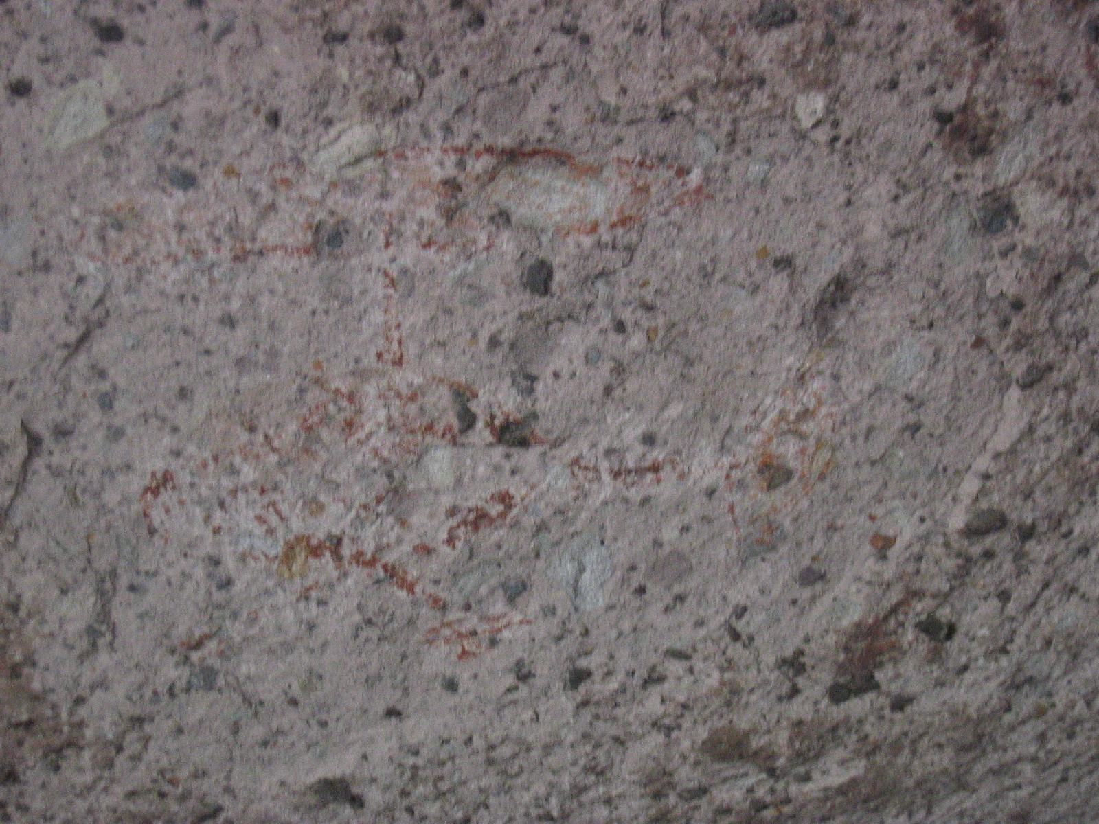 Salvador pointed out this unfortunate graffitti at the back of the cave. Hard to make out because someone has tried to remove it.